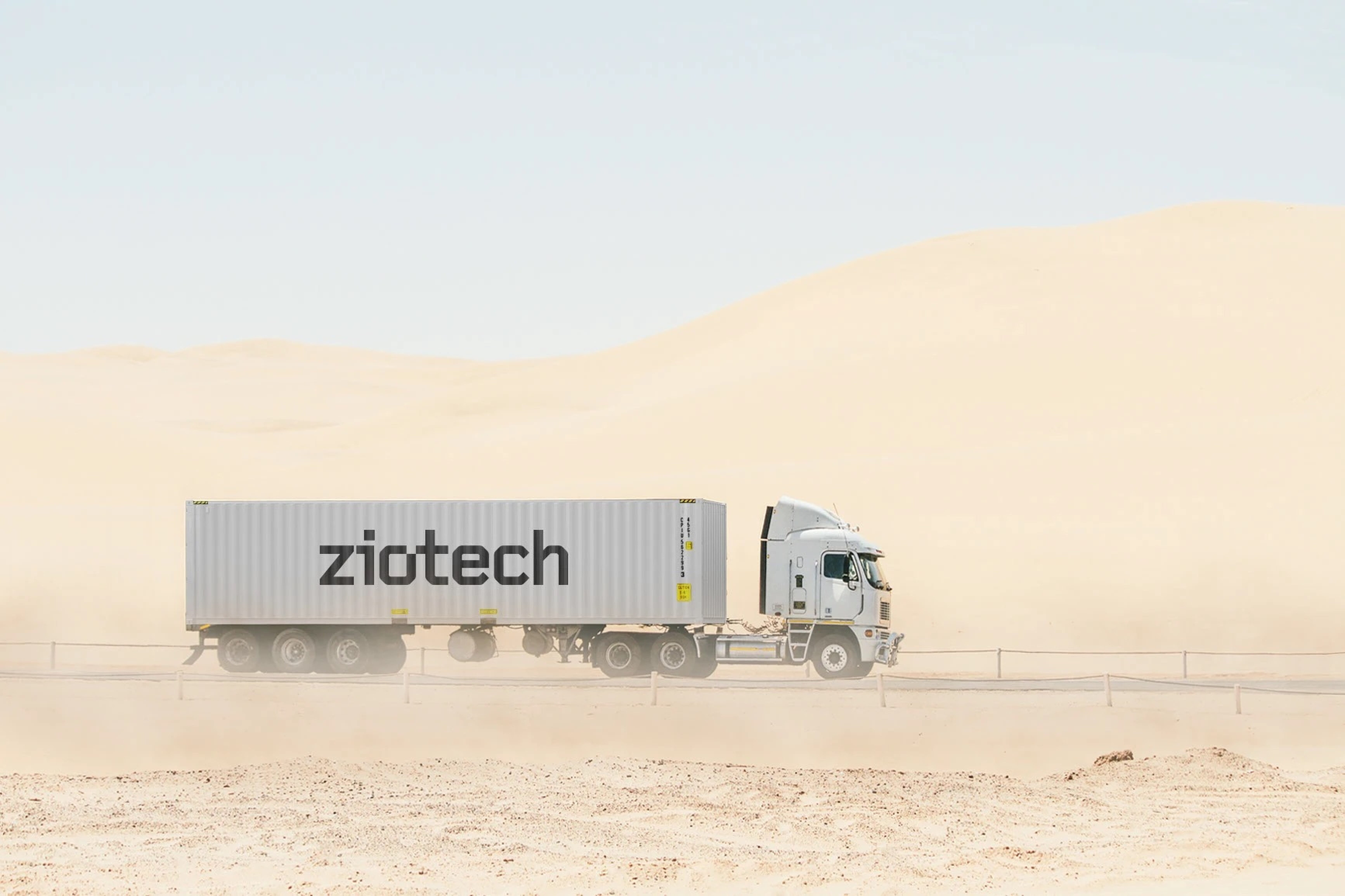 Ziotech-branded freight container on a truck crossing the desert