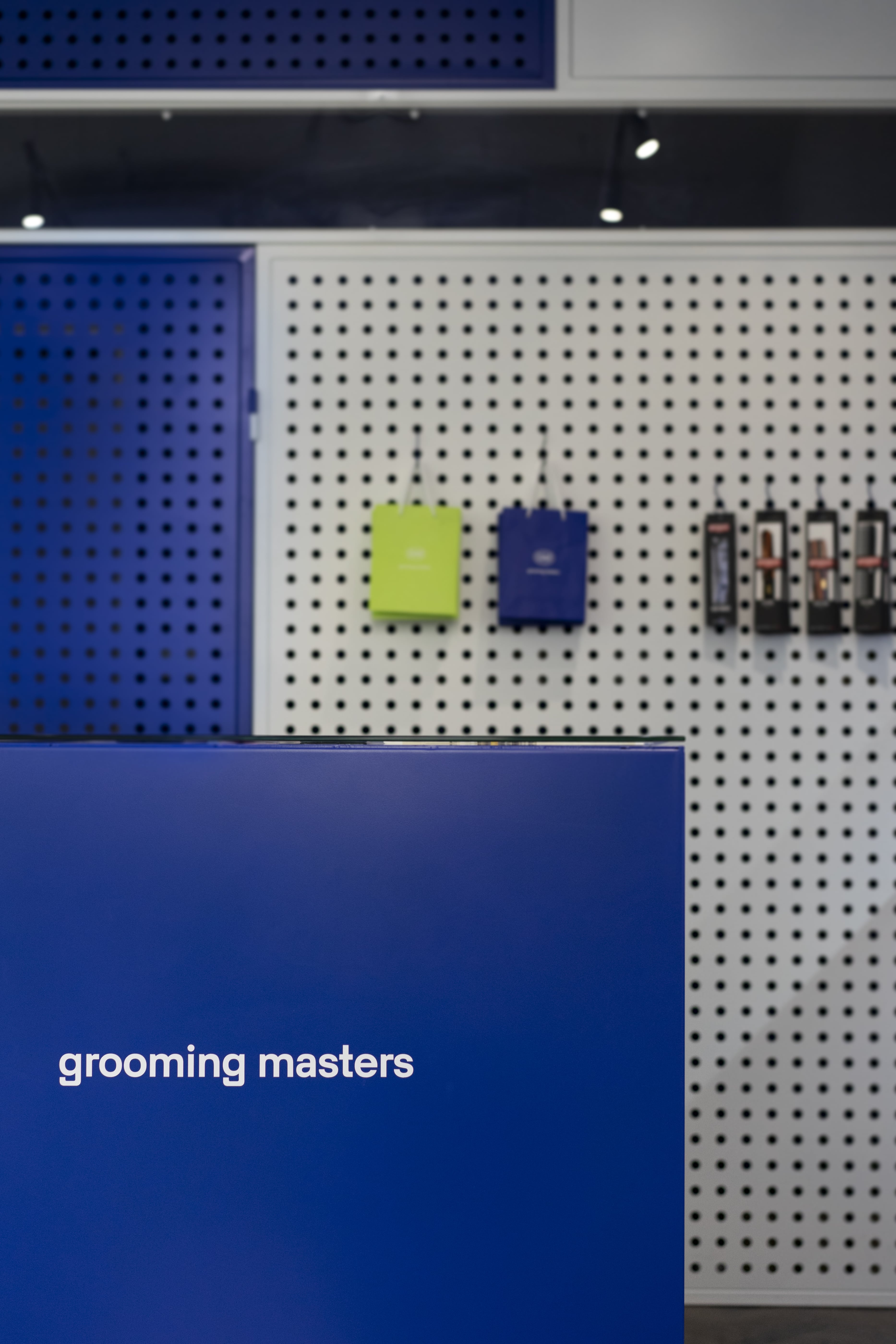 The Klein-blue counter at The Embassy, Grooming Masters set in white on its face