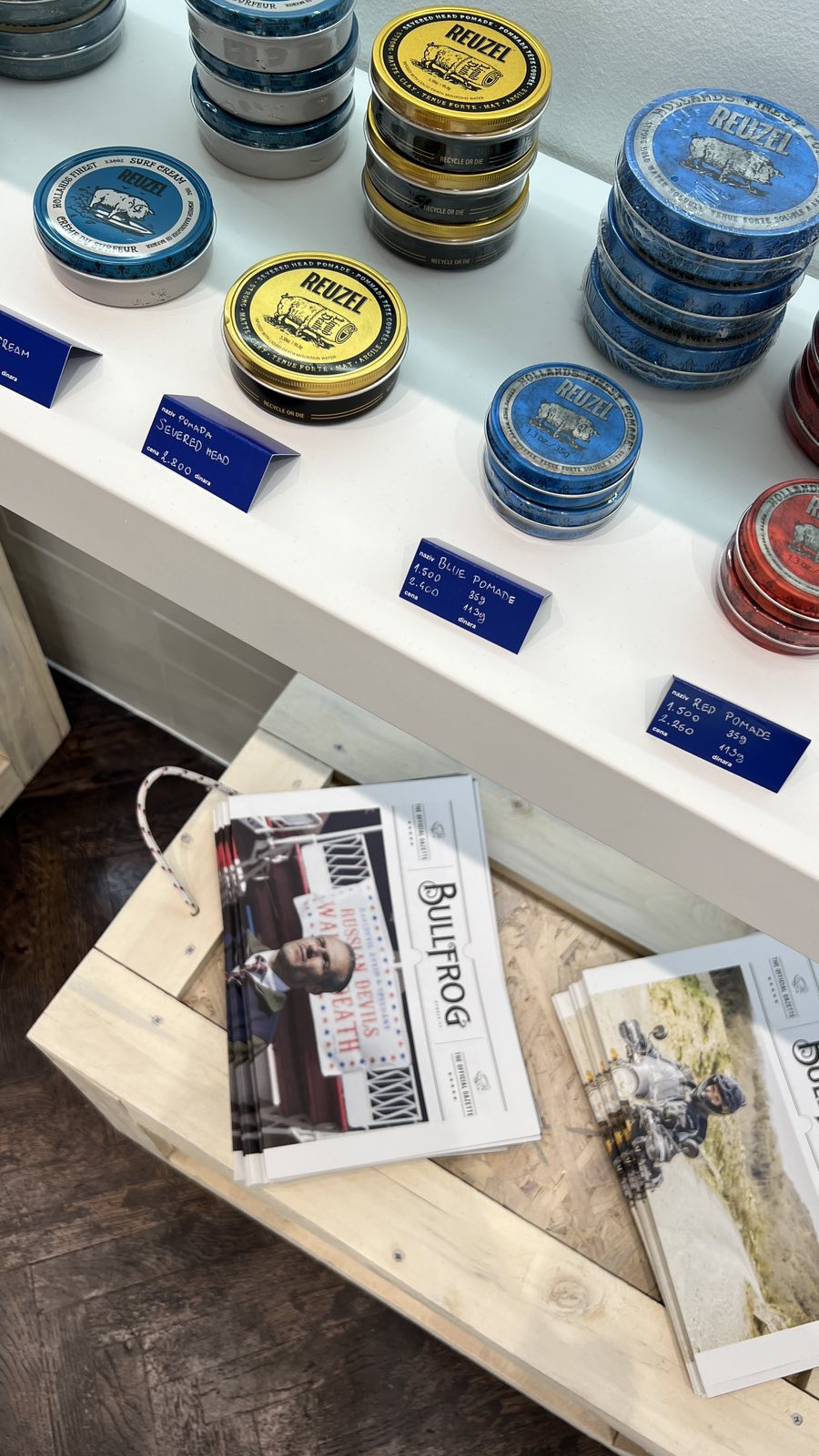 Reuzel pomades priced clearly on the shelf