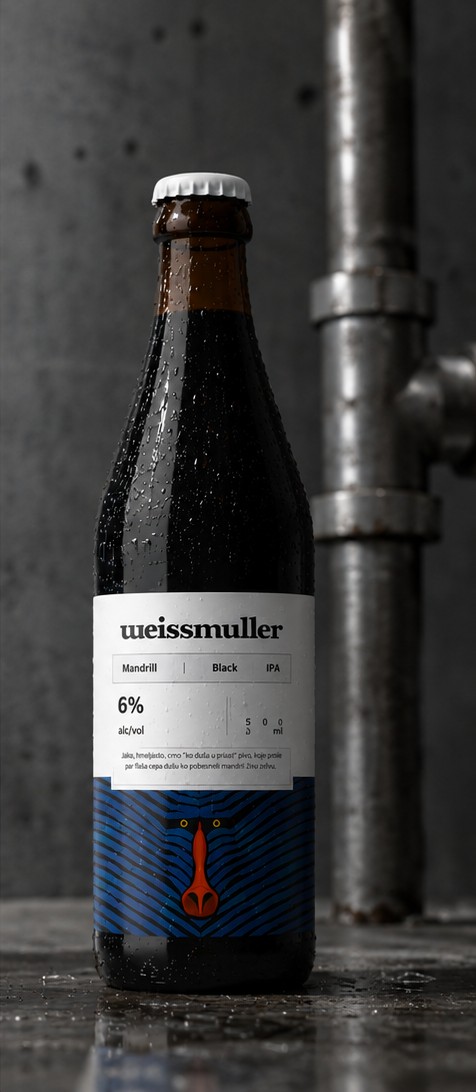 Weissmuller Mandrill bottle against concrete with an exposed steel pipe, condensation beading down the glass